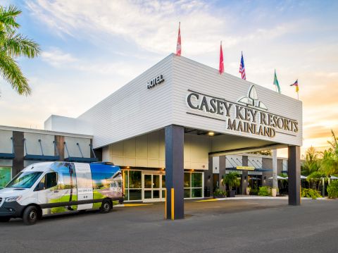 A Casey Key Resorts office, with a van parked outside&mdash;vibrant resort entrance at sunset.